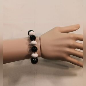 woman black and white bracelet